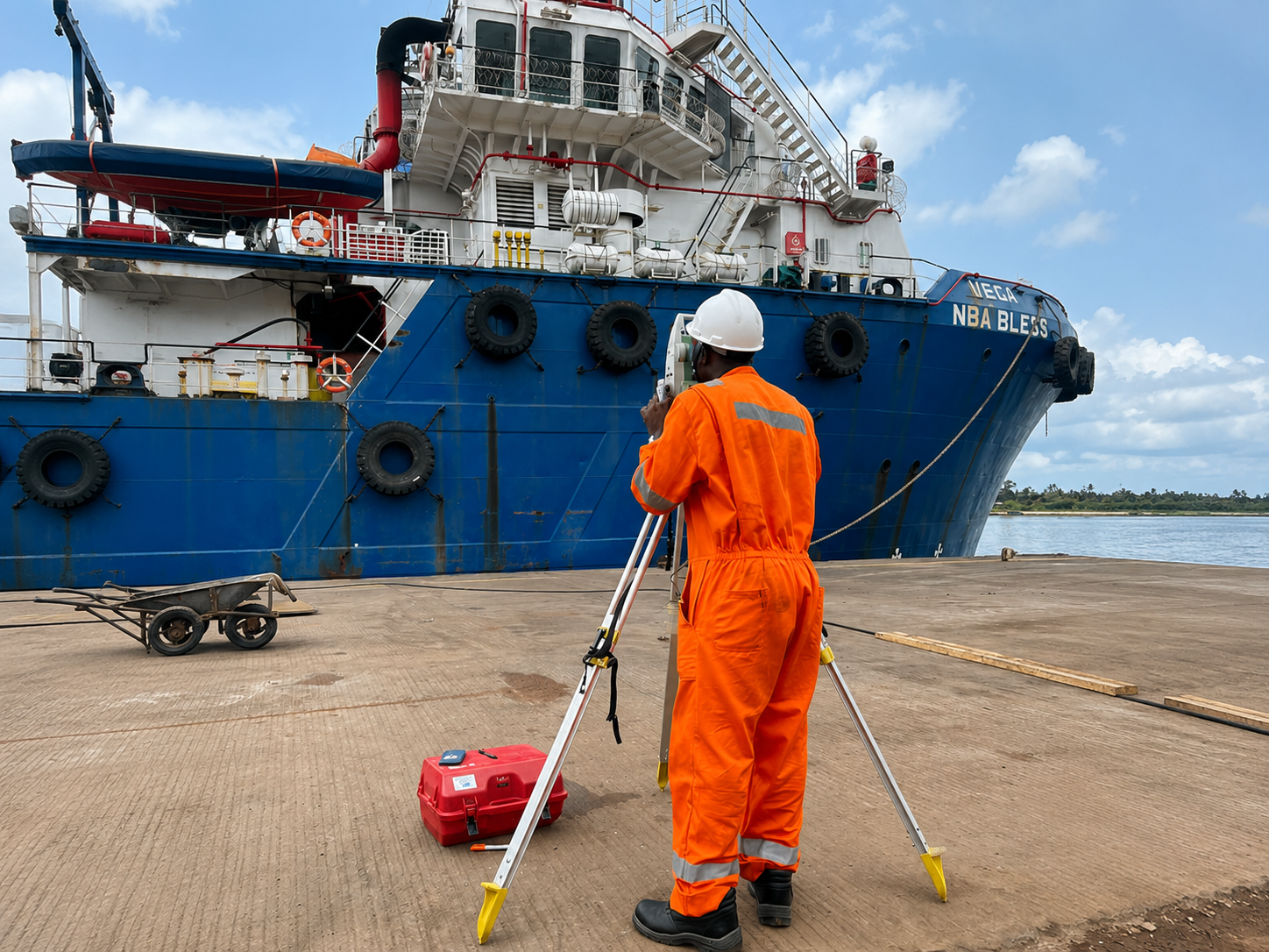 Surveyor conducting a hydrographic survey alongside a vessel