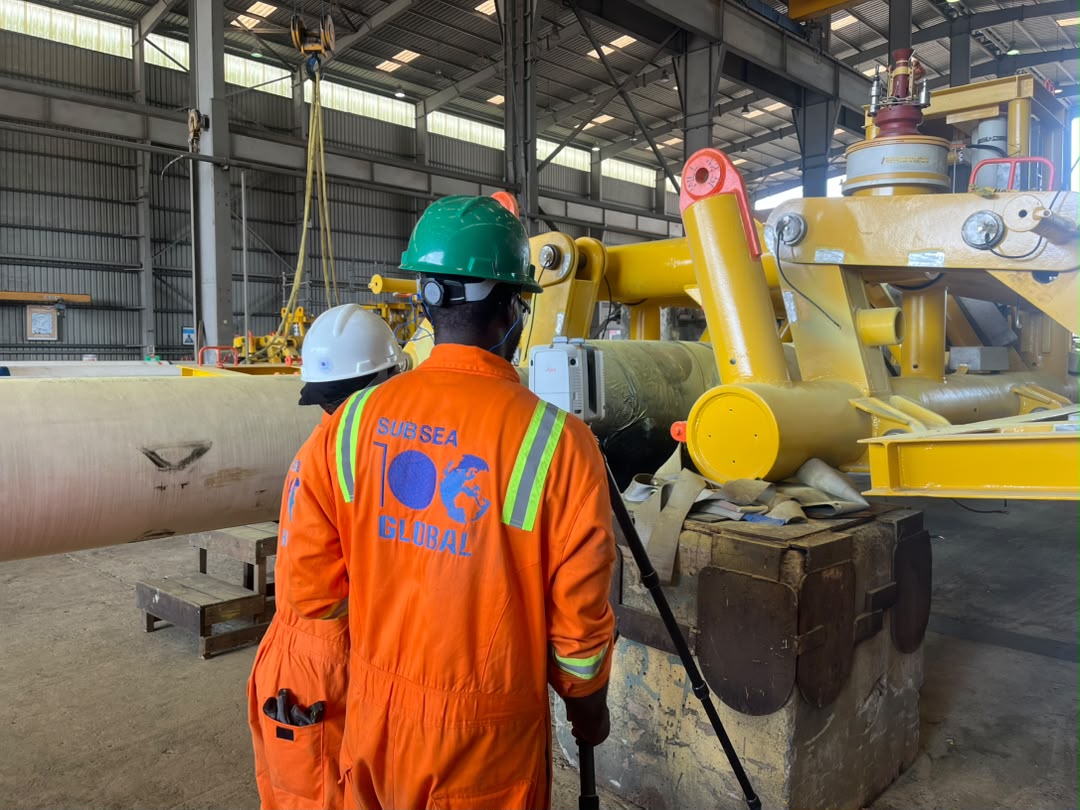 Subsea100 technician with subsea tooling and wellhead equipment